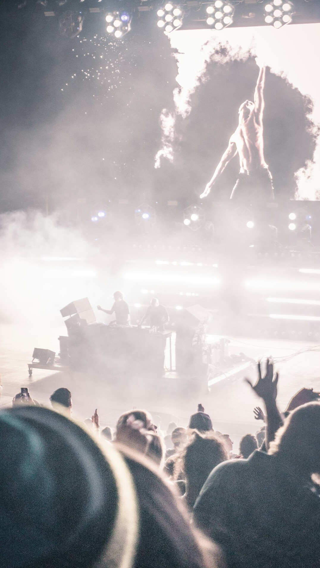 Live concert with stage lights and crowd