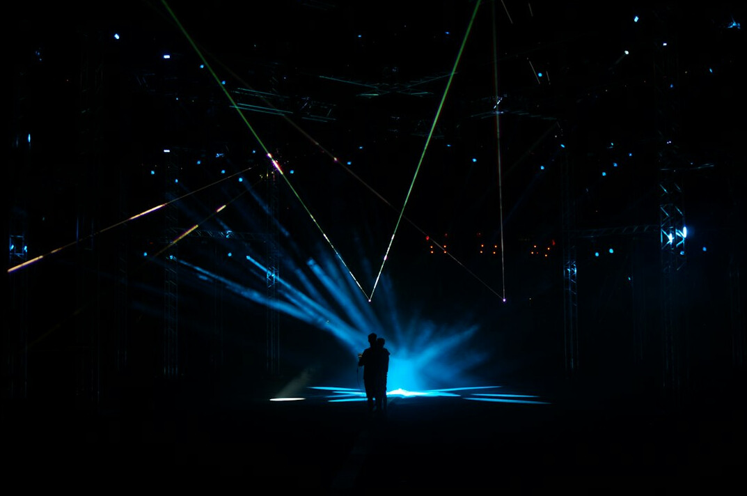 Professional stage lighting rig with colourful beams